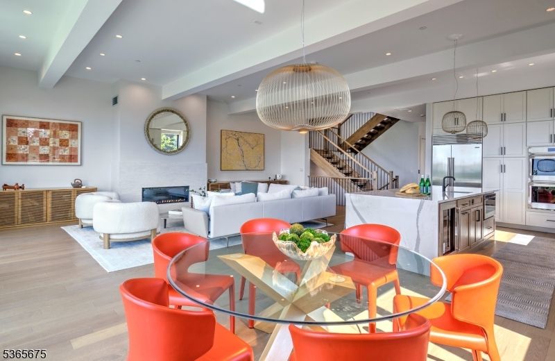 Dining room, Fireplace, Interior, Kitchen, Living room, Pendant Lights, Recessed Lighting, Stainless Steel Appliances, Wood Texture Flooring
