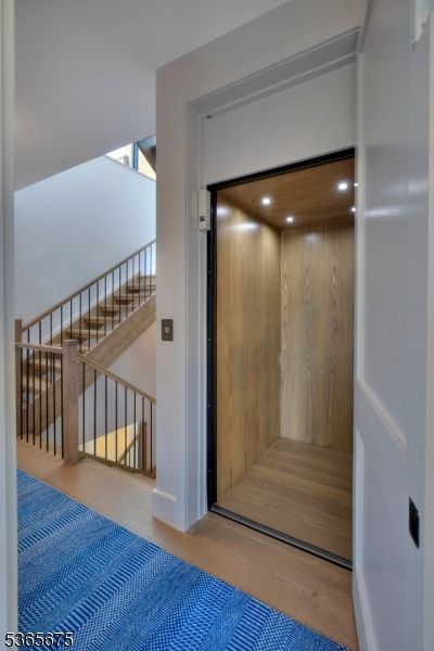 Elevator, Interior, Recessed Lighting, Wooden Ceilings, Wood Texture Flooring, Wooden Walls