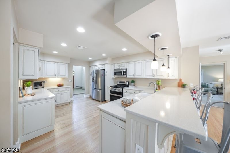 Interior, Kitchen, Pendant Lights, Recessed Lighting, Stainless Steel Appliances, Wood Texture Flooring