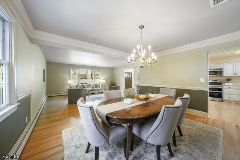 Chandelier, Dining room, Interior, Kitchen, Living room, Recessed Lighting, Stainless Steel Appliances, Wood Texture Flooring