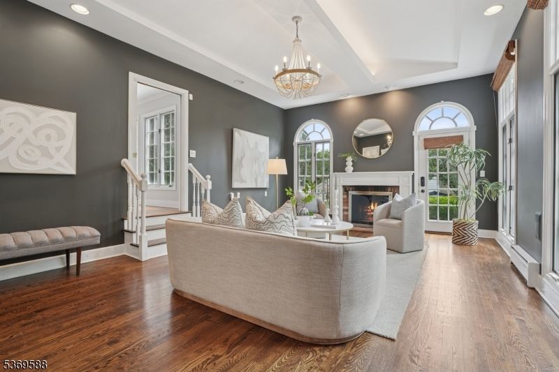 Chandelier, Fireplace, Interior, Living room, Recessed Lighting, Wood Texture Flooring