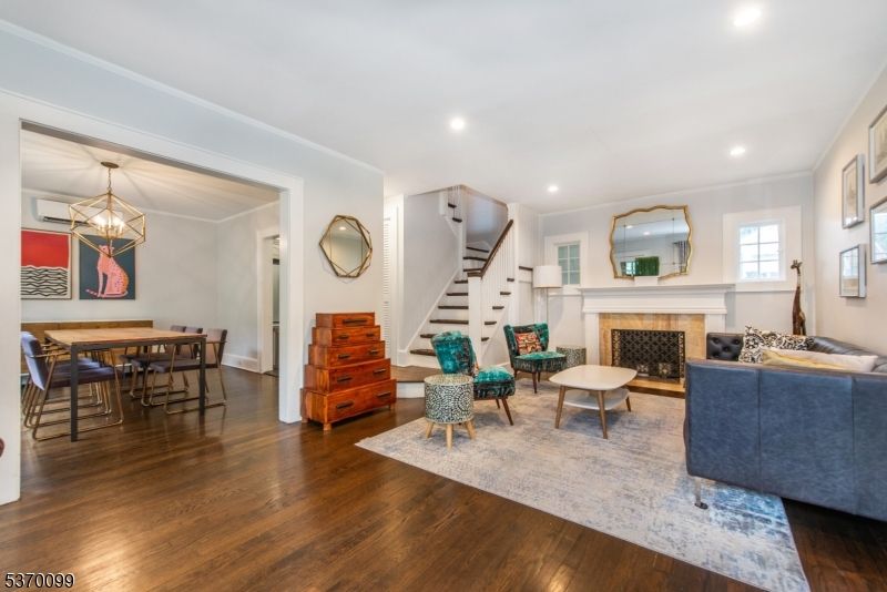 Dining room, Fireplace, Interior, Living room, Pendant Lights, Recessed Lighting, Wood Texture Flooring