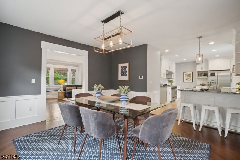 Dining room, Interior, Kitchen, Pendant Lights, Recessed Lighting, Stainless Steel Appliances, Wood Texture Flooring