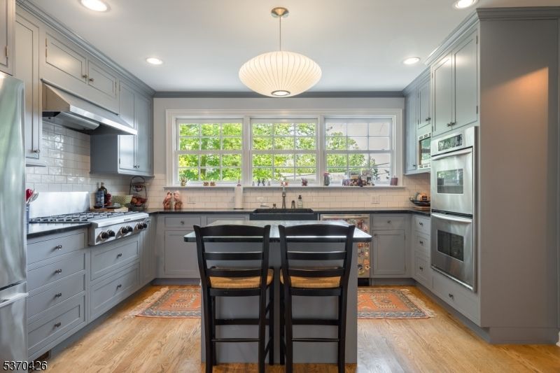 Interior, Kitchen, Pendant Lights, Recessed Lighting, Stainless Steel Appliances, Wood Texture Flooring