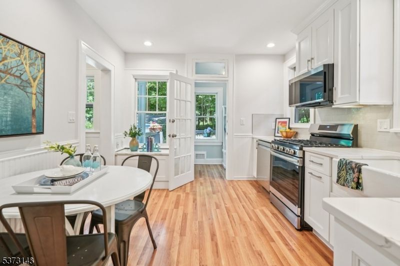 Dining room, Interior, Kitchen, Recessed Lighting, Stainless Steel Appliances, Wood Texture Flooring