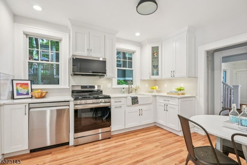 Dining room, Interior, Kitchen, Recessed Lighting, Stainless Steel Appliances, Wood Texture Flooring
