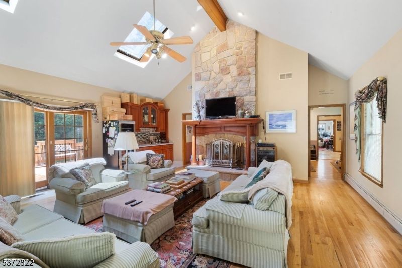 Fireplace, Interior, Living room, Recessed Lighting, Stone Walls, Wood Texture Flooring