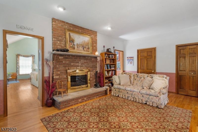 Fireplace, Interior, Recessed Lighting, Stone Walls, Wood Texture Flooring