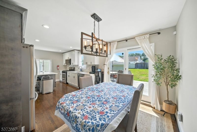 Dining room, Interior, Kitchen, Pendant Lights, Recessed Lighting, Stainless Steel Appliances, Wood Texture Flooring