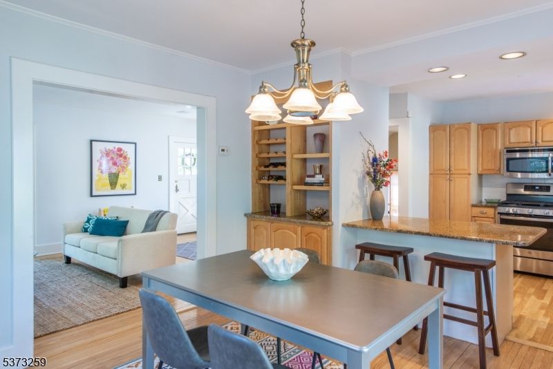 Chandelier, Dining room, Interior, Kitchen, Living room, Recessed Lighting, Stainless Steel Appliances, Wood Texture Flooring