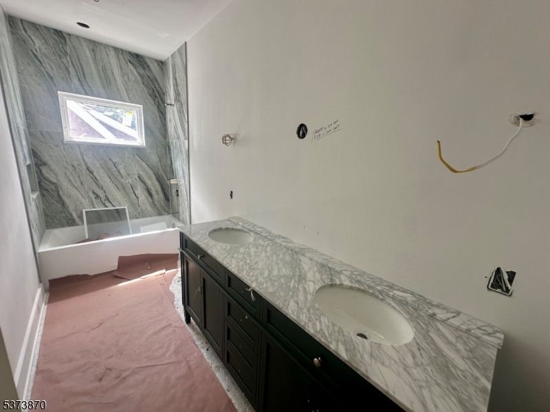 Bathroom, Dual Sink Vanities, Interior, Marble, Marble Walls, Recessed Lighting