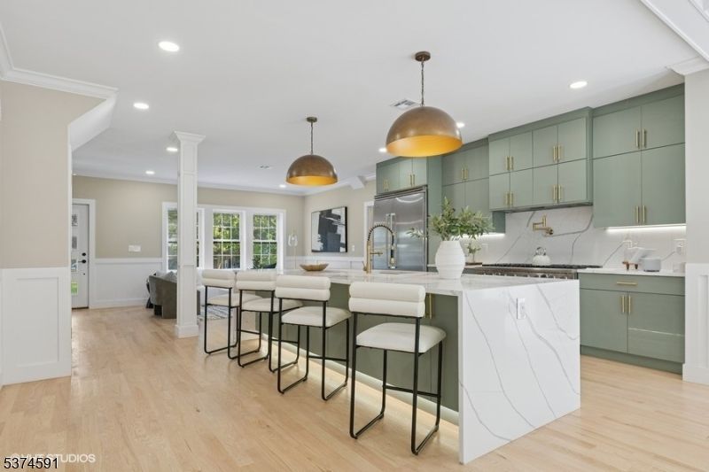 Interior, Kitchen, Marble Walls, Pendant Lights, Recessed Lighting, Wood Texture Flooring