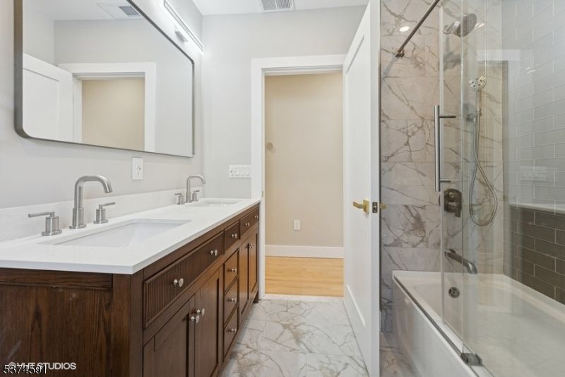 Bathroom, Dual Sink Vanities, Glass Shower, Interior, Marble, Marble Walls, Wood Texture Flooring