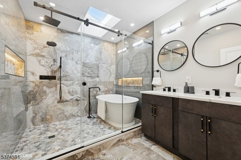 Bathroom, Dual Sink Vanities, Free Standing Baths, Glass Shower, Interior, Marble Walls, Recessed Lighting