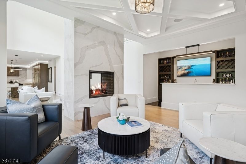 Fireplace, Interior, Living room, Marble Walls, Pendant Lights, Recessed Lighting, Wood Texture Flooring