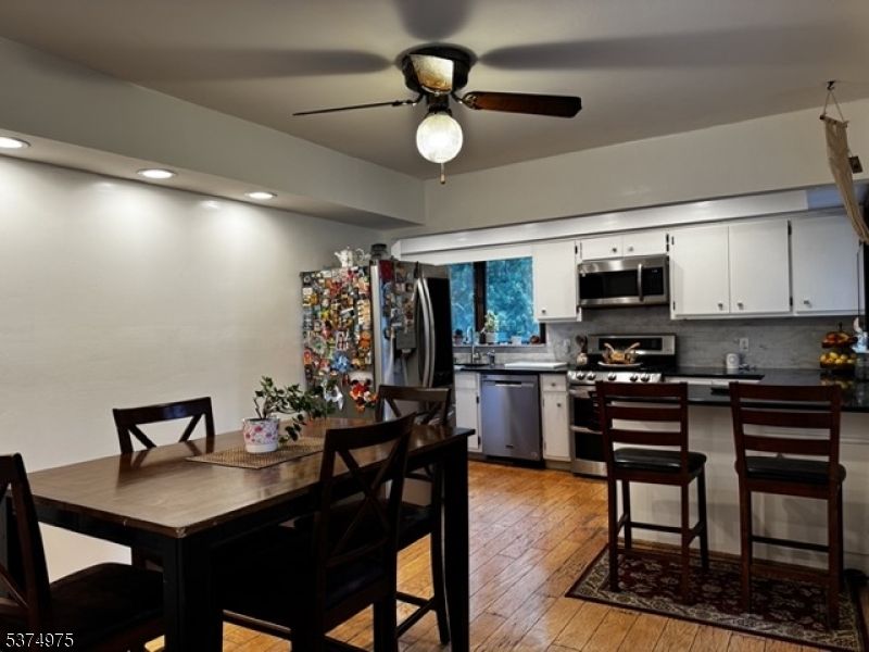 Dining room, Interior, Kitchen, Recessed Lighting, Stainless Steel Appliances, Wood Texture Flooring