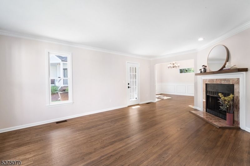 Chandelier, Empty room, Fireplace, Interior, Recessed Lighting, Wood Texture Flooring