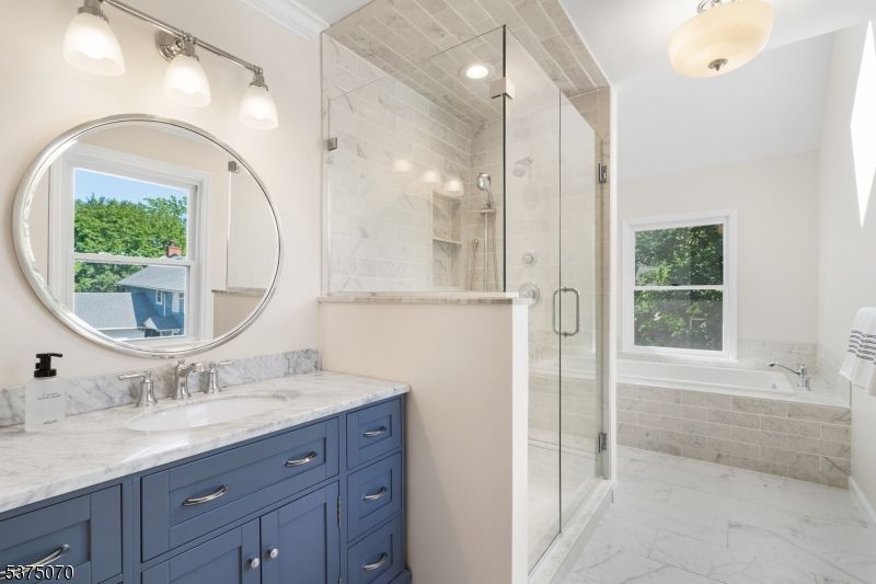 Bathroom, Dual Sink Vanities, Glass Shower, Interior, Marble, Marble Walls, Recessed Lighting
