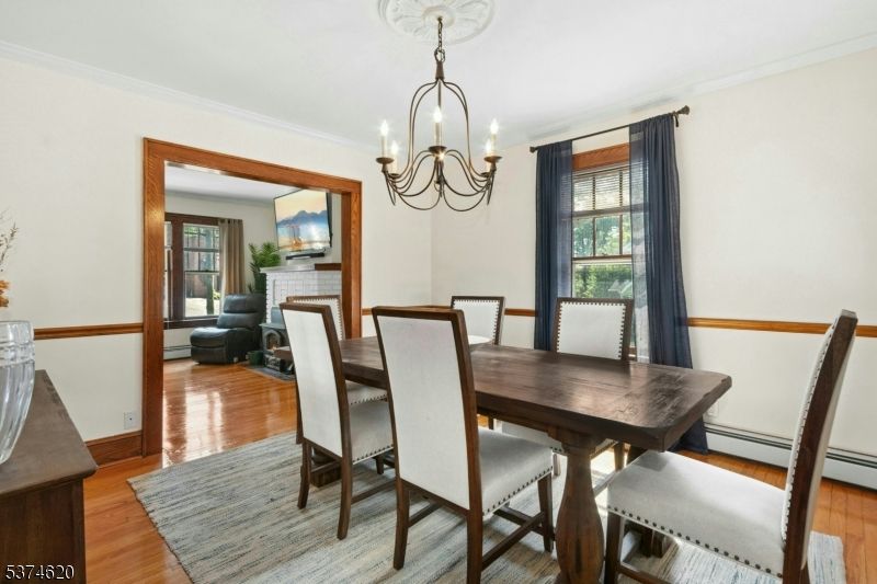Chandelier, Dining room, Fireplace, Interior, Wood Texture Flooring