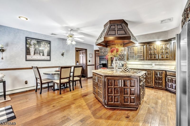 Dining room, Interior, Kitchen, Recessed Lighting, Stainless Steel Appliances, Wood Texture Flooring