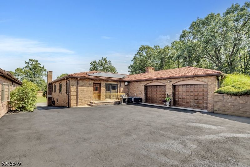 Attached, Exterior, Facade, Brick Facade, Solar Panels, Mediterranean