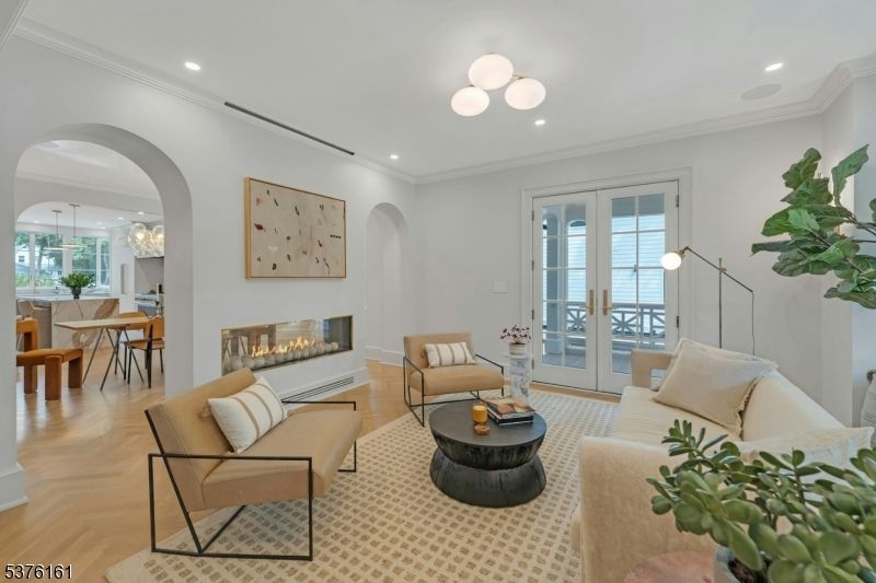 Chandelier, Dining room, Fireplace, Interior, Living room, Pendant Lights, Recessed Lighting, Wood Texture Flooring