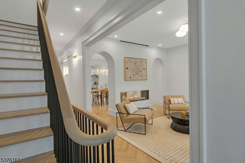 Dining room, Fireplace, Interior, Living room, Recessed Lighting, Wood Texture Flooring