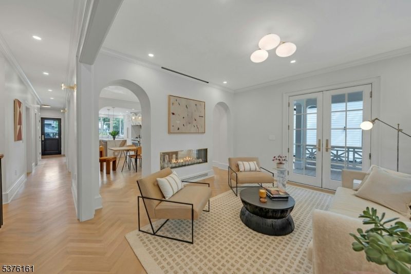 Dining room, Fireplace, Interior, Living room, Pendant Lights, Recessed Lighting, Wood Texture Flooring