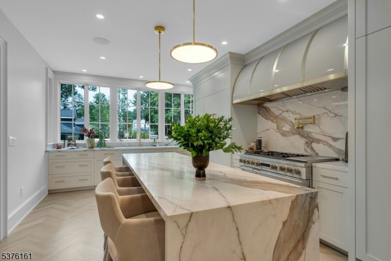 Interior, Kitchen, Marble Walls, Pendant Lights, Recessed Lighting, Stainless Steel Appliances, Wood Texture Flooring