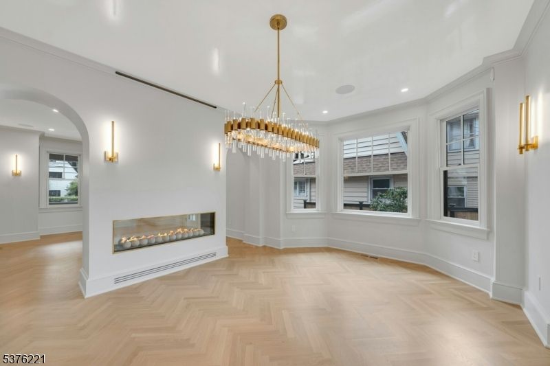 Chandelier, Empty room, Fireplace, Interior, Pendant Lights, Recessed Lighting, Wood Texture Flooring