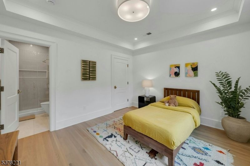 Bathroom, Bedroom, Glass Shower, Interior, Recessed Lighting, Wood Texture Flooring