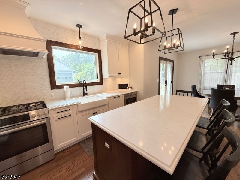 Chandelier, Dining room, Interior, Kitchen, Pendant Lights, Stainless Steel Appliances, Wood Texture Flooring