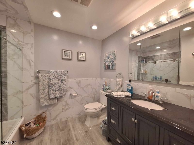 Bathroom, Glass Shower, Interior, Marble Walls, Recessed Lighting, Wood Texture Flooring