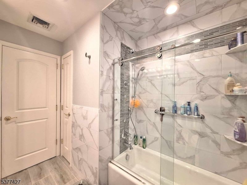 Bathroom, Glass Shower, Interior, Marble Walls, Recessed Lighting, Wood Texture Flooring