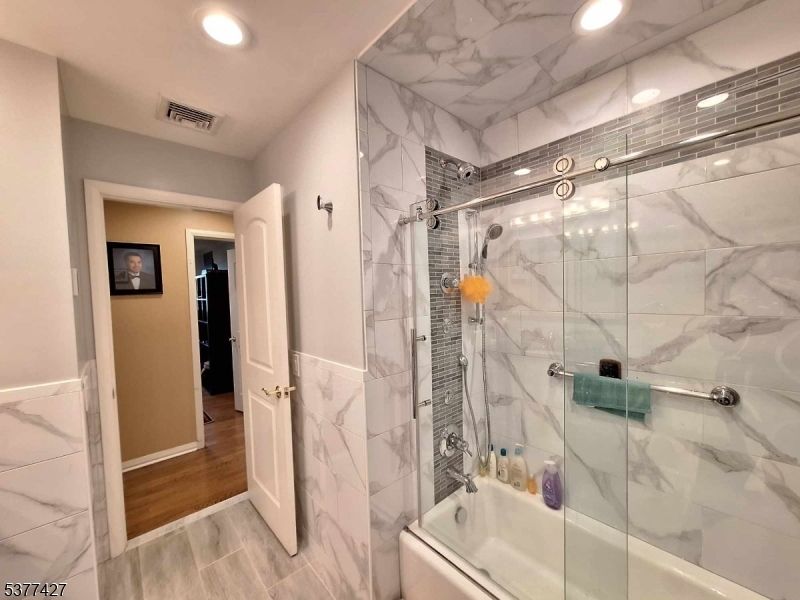 Bathroom, Glass Shower, Interior, Marble Walls, Recessed Lighting, Wood Texture Flooring