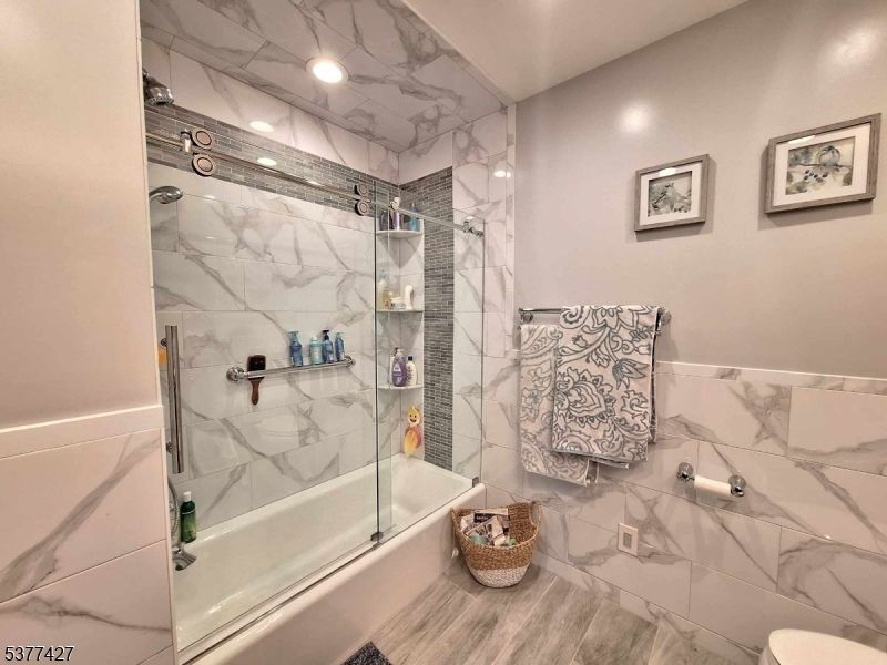 Bathroom, Glass Shower, Interior, Marble Walls, Recessed Lighting, Wood Texture Flooring