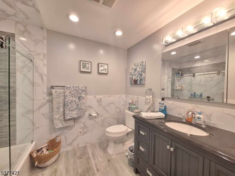 Bathroom, Glass Shower, Interior, Marble Walls, Recessed Lighting, Wood Texture Flooring