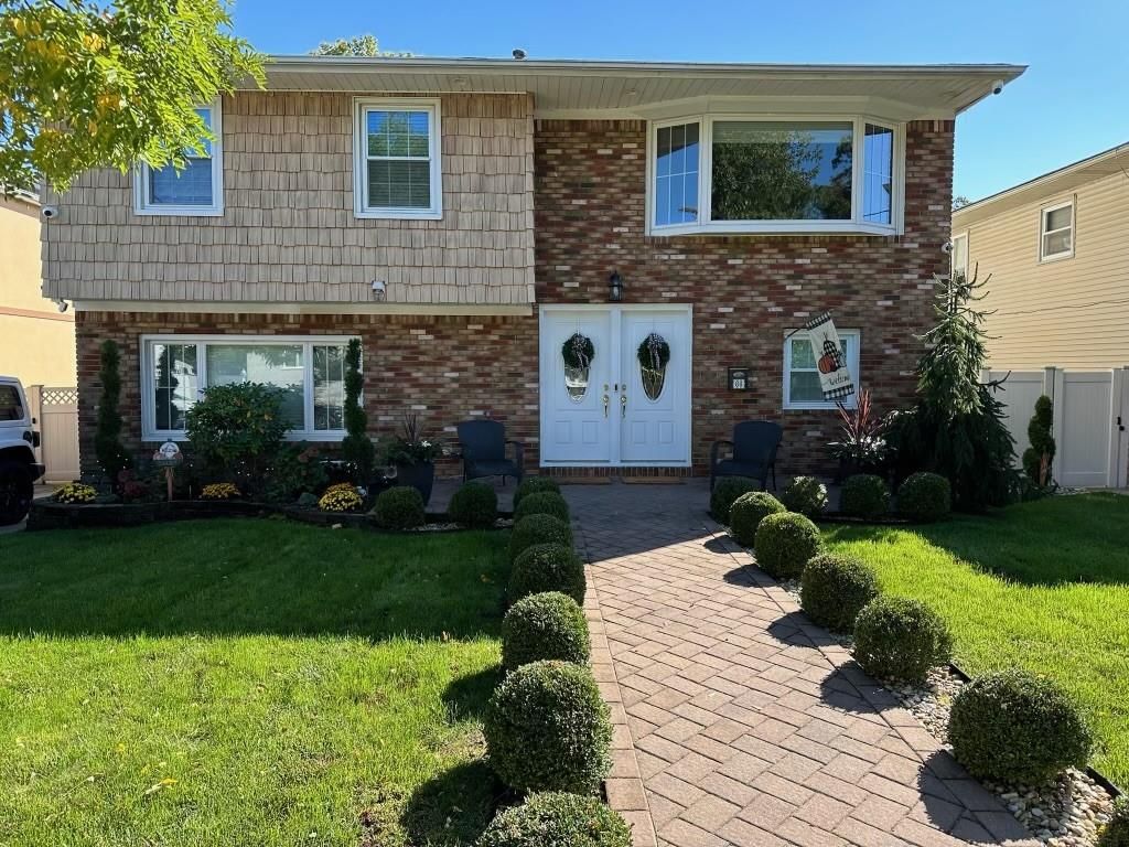 Exterior, Facade, Brick Facade, Raised Ranch