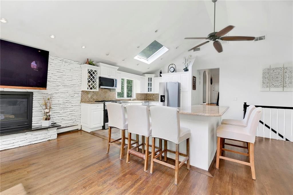 Fireplace, Interior, Kitchen, Recessed Lighting, Wood Texture Flooring