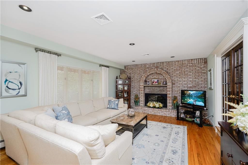 Fireplace, Interior, Living room, Recessed Lighting, Stone Walls, Wood Texture Flooring