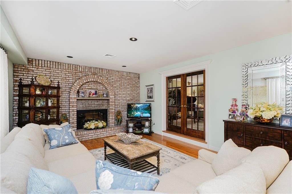 Fireplace, Interior, Living room, Recessed Lighting, Stone Walls, Wood Texture Flooring