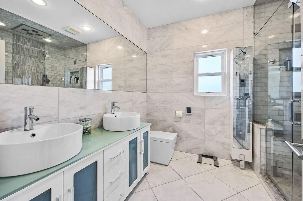 Bathroom, Dual Sink Vanities, Glass Shower, Interior, Marble Walls, Recessed Lighting