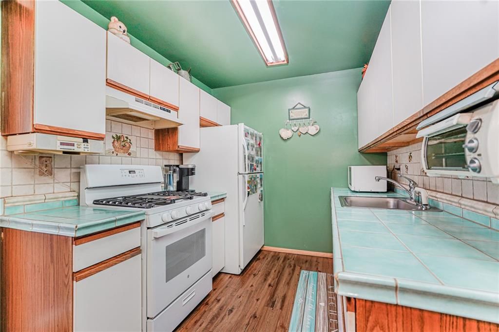 Interior, Kitchen, Tile Countertops, Wood Texture Flooring