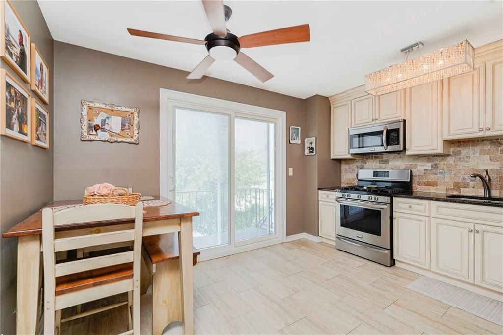 Chandelier, Dining room, Interior, Kitchen, Stainless Steel Appliances, Wood Texture Flooring