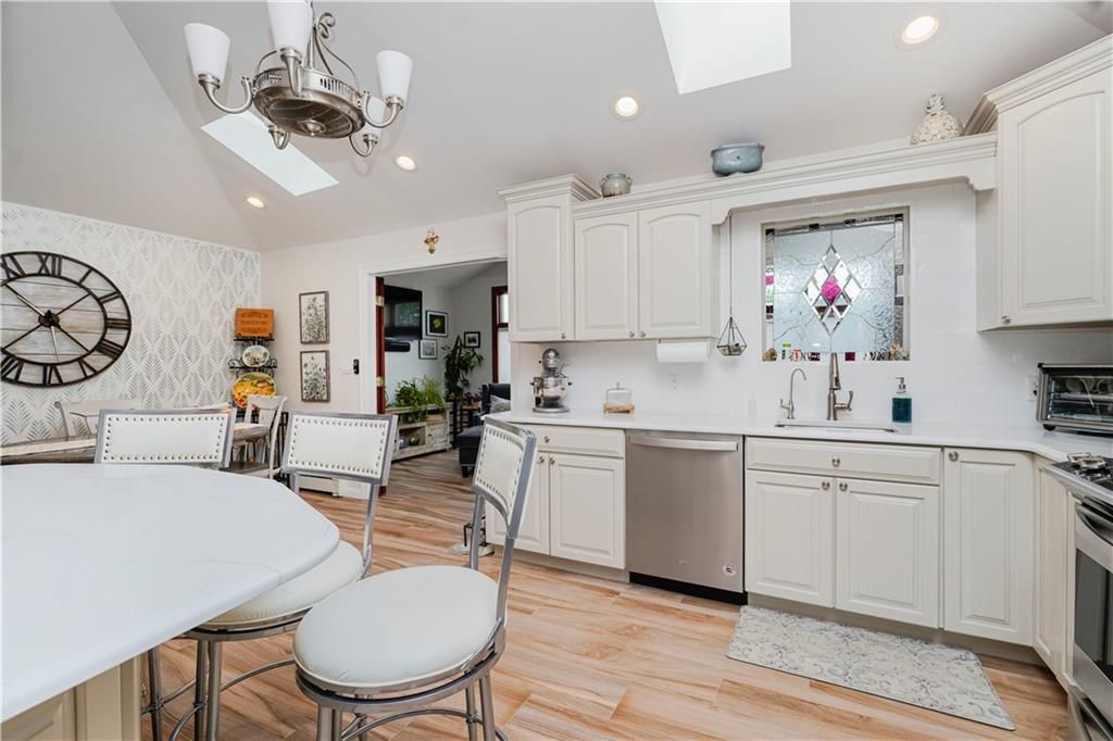 Dining room, Interior, Kitchen, Recessed Lighting, Stainless Steel Appliances, Wood Texture Flooring