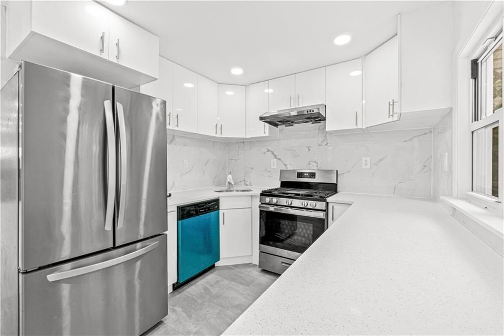 Interior, Kitchen, Marble Walls, Recessed Lighting, Stainless Steel Appliances