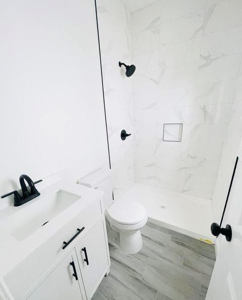 Bathroom, Glass Shower, Interior, Marble Walls, Wood Texture Flooring