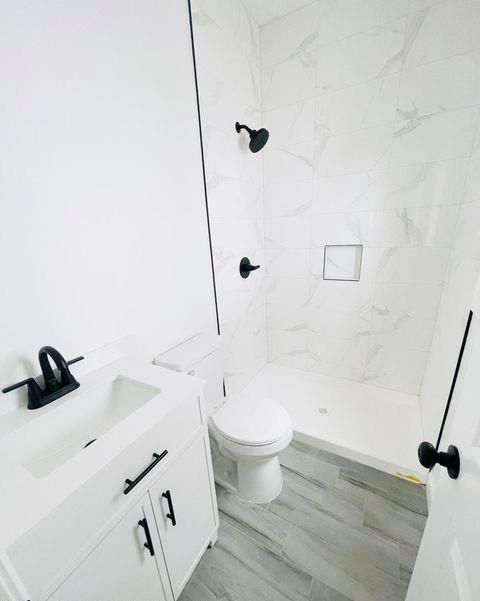 Bathroom, Glass Shower, Interior, Marble Walls, Wood Texture Flooring