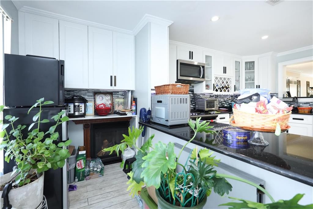 Fireplace, Interior, Kitchen, Recessed Lighting, Wood Texture Flooring