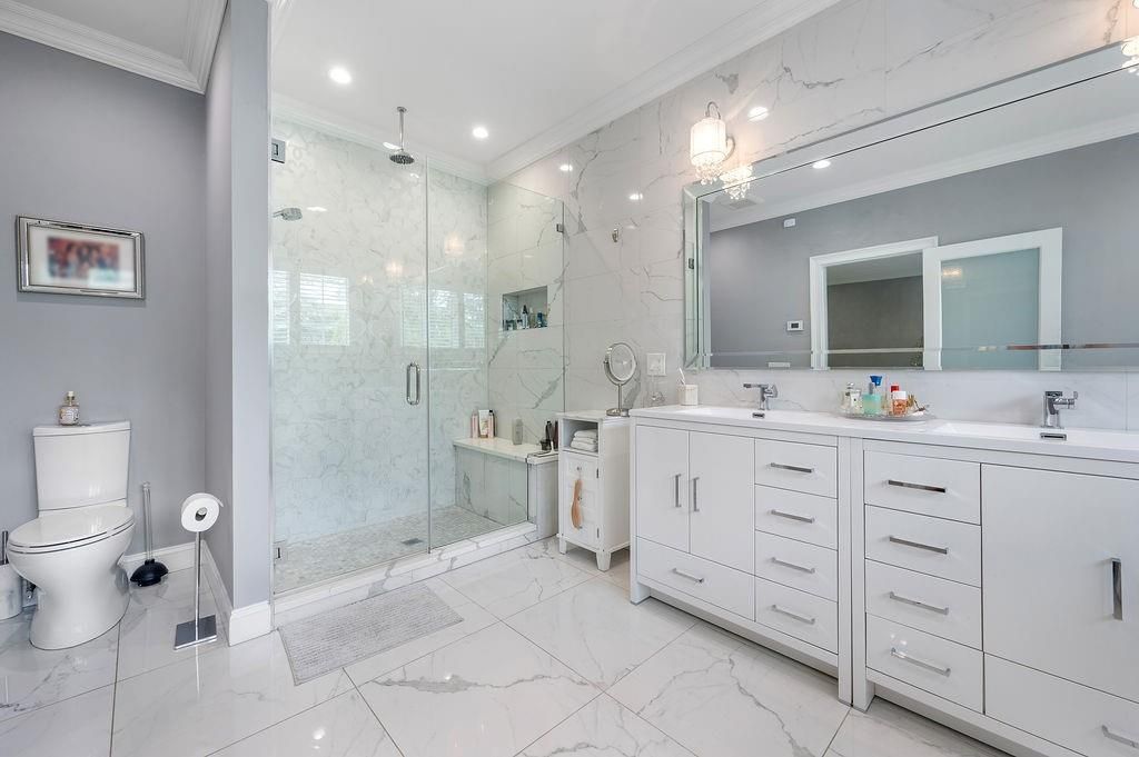 Bathroom, Dual Sink Vanities, Glass Shower, Interior, Marble, Marble Walls, Recessed Lighting